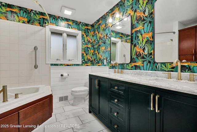 full bath with wallpapered walls, visible vents, and a sink