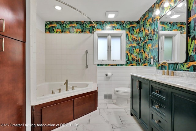 bathroom featuring wallpapered walls, a bathtub, toilet, marble finish floor, and visible vents