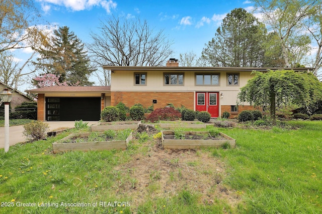 view of front of property featuring brick siding, concrete driveway, a garage, a chimney, and a garden