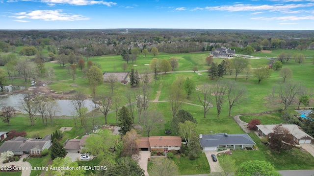 aerial view featuring a water view, golf course view, and a residential view