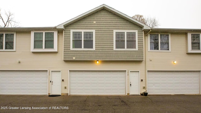 13799 Mead Creek Rd Unit 63D, Bath, MI 48808 - view of front of house with an attached garage