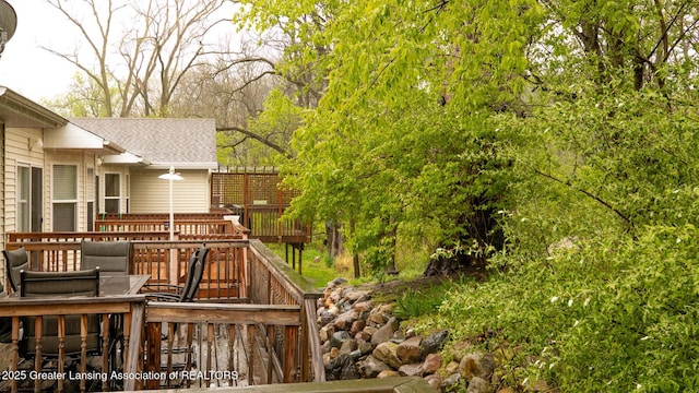 13799 Mead Creek Rd Unit 63D, Bath, MI 48808 - view of yard featuring a deck