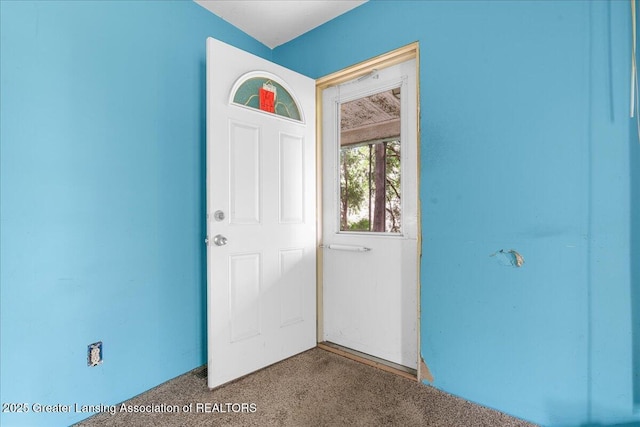 view of carpeted foyer