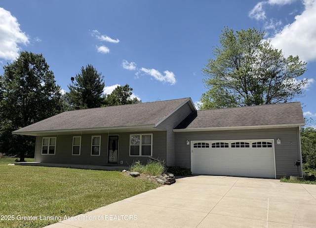 5205 N Bailey Rd, Coral, MI 49322 - single story home with an attached garage, driveway, and a front yard