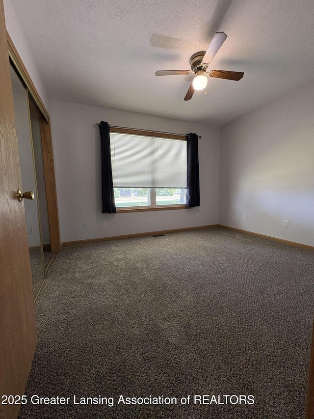 5205 N Bailey Rd, Coral, MI 49322 - carpeted empty room featuring a ceiling fan and baseboards