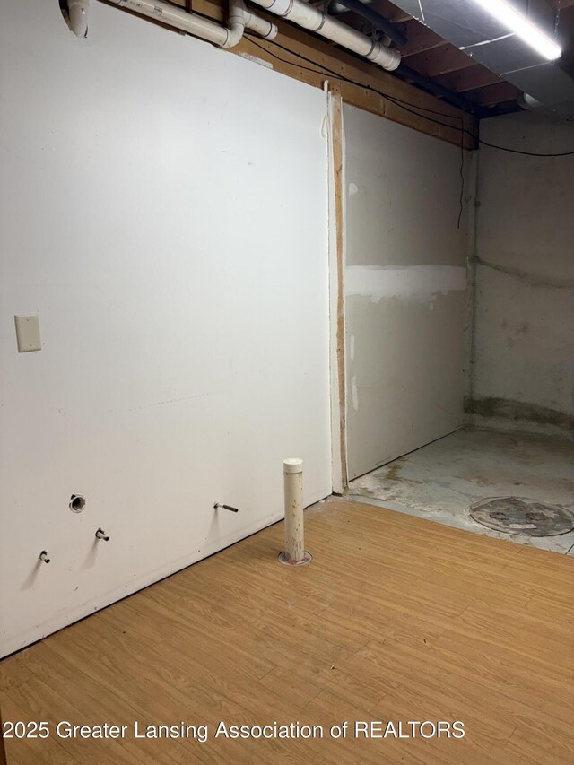 5205 N Bailey Rd, Coral, MI 49322 - unfinished basement featuring wood finished floors