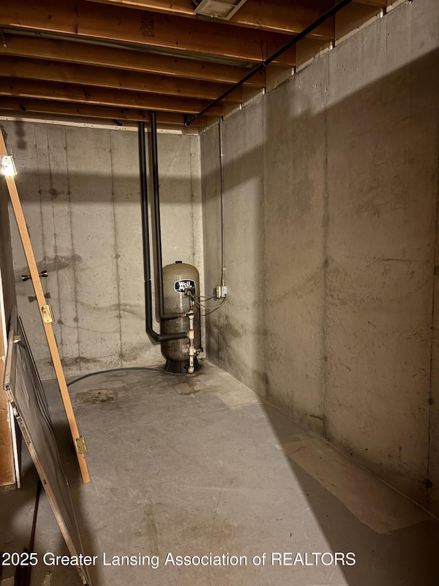 5205 N Bailey Rd, Coral, MI 49322 - unfinished basement with a water pressure tank