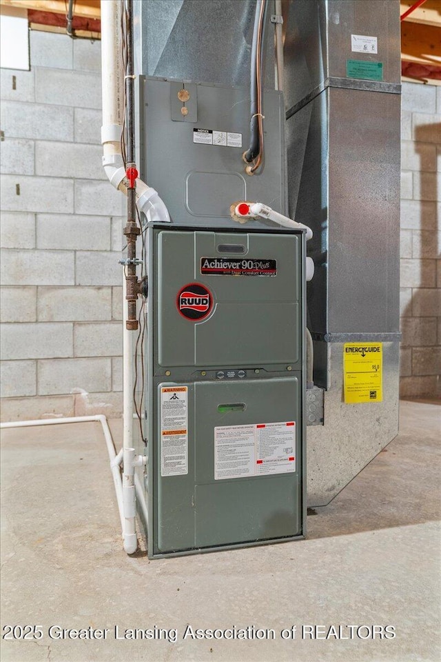 utility room featuring heating unit