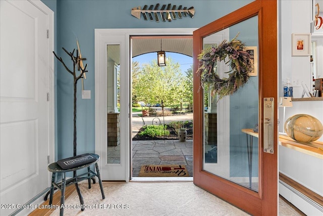 doorway featuring baseboard heating