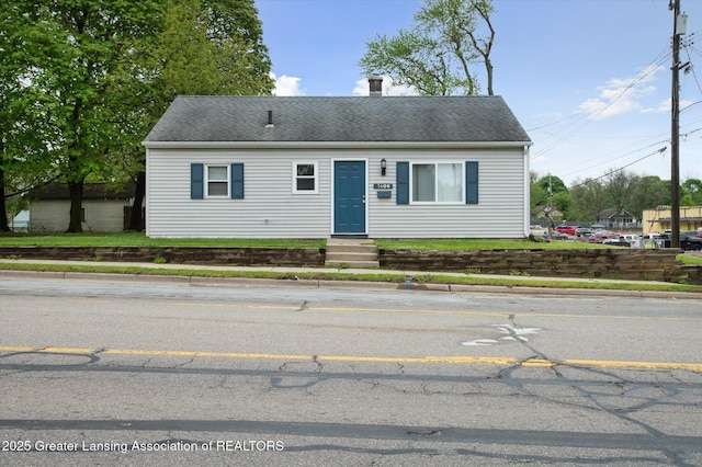 1406 N Martin Luther King Jr Blvd, Lansing, MI 48915 - view of front of property featuring entry steps and a shingled roof