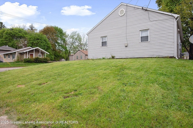 1406 N Martin Luther King Jr Blvd, Lansing, MI 48915 - view of home's exterior with a yard
