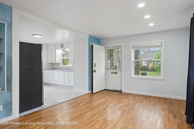 900 Holten St, Lansing, MI 48915 - foyer entrance with light wood-style floors, baseboards, plenty of natural light, and recessed lighting