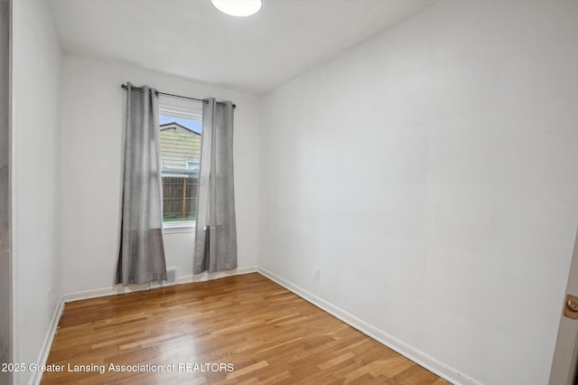 900 Holten St, Lansing, MI 48915 - unfurnished room featuring light wood finished floors and baseboards