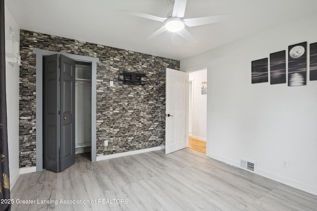 900 Holten St, Lansing, MI 48915 - spare room with ceiling fan, wood finished floors, and baseboards