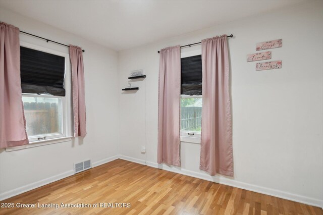 900 Holten St, Lansing, MI 48915 - unfurnished room featuring wood finished floors and baseboards
