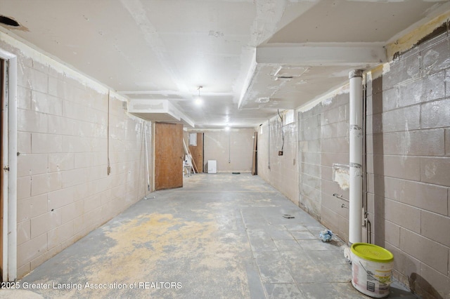 900 Holten St, Lansing, MI 48915 - unfinished basement with concrete block wall