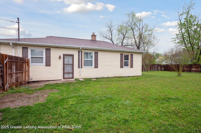 900 Holten St, Lansing, MI 48915 - rear view of property featuring a chimney