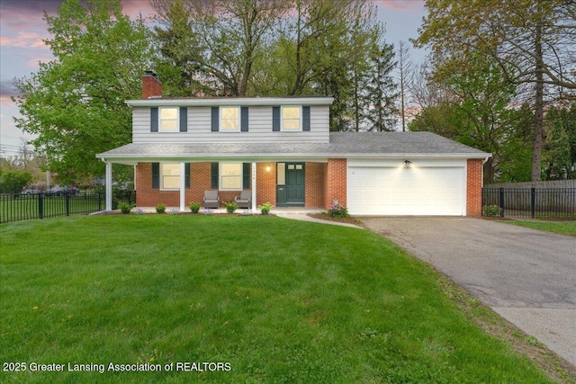 traditional-style house featuring covered porch, fence, driveway, a garage, and a chimney