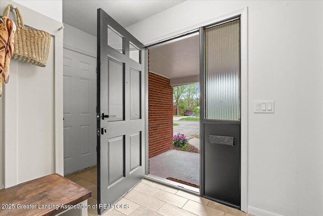 entrance foyer with light tile patterned floors