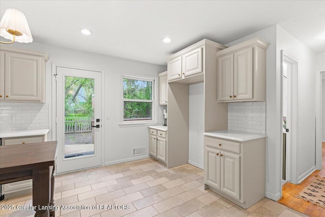 mudroom with visible vents, baseboards, and recessed lighting