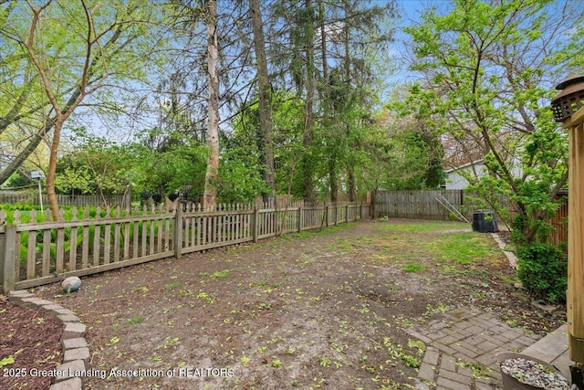 view of yard with a fenced backyard