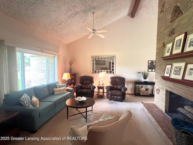 living room with carpet, ceiling fan, a textured ceiling, a fireplace, and beam ceiling