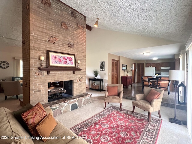 living area with light colored carpet, a textured ceiling, a fireplace, and high vaulted ceiling