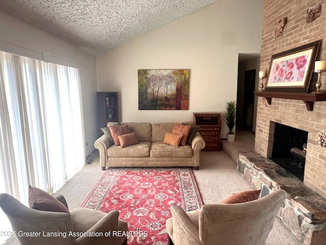 living room with carpet floors, vaulted ceiling, a textured ceiling, and a brick fireplace