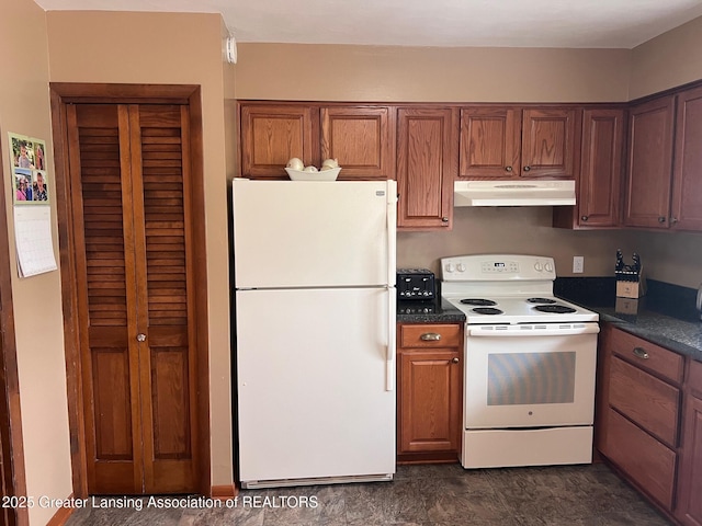 kitchen with white appliances, under cabinet range hood, dark countertops, and brown cabinetry