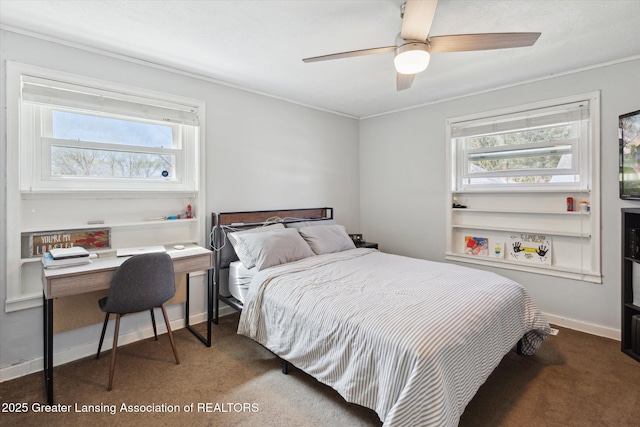 carpeted bedroom featuring a ceiling fan, multiple windows, and ornamental molding