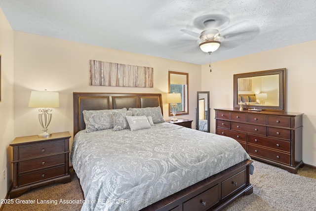 bedroom featuring dark colored carpet and a ceiling fan
