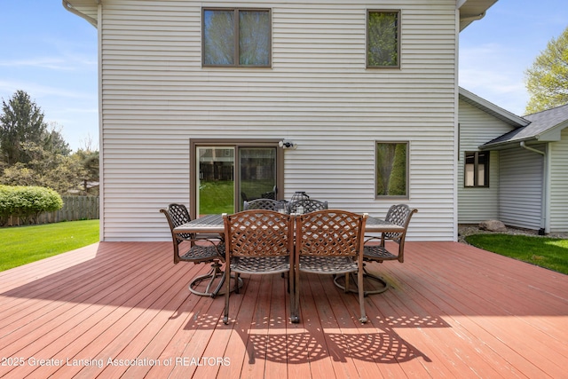 wooden terrace featuring outdoor dining area
