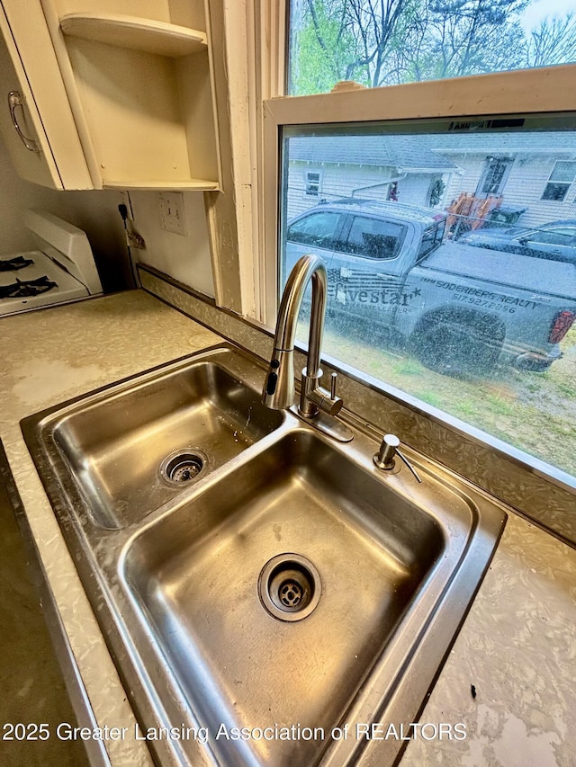 room details with open shelves and a sink