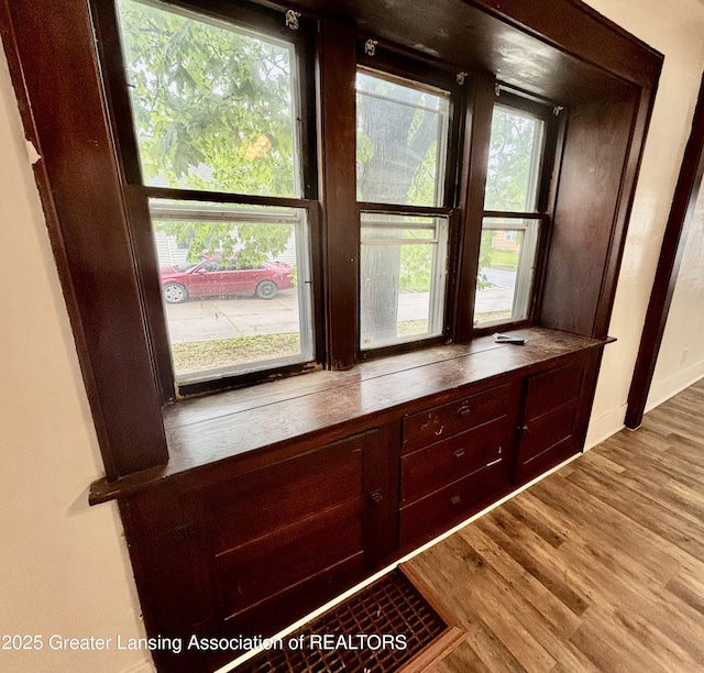 room details with baseboards and wood finished floors