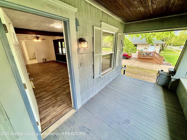 wooden terrace featuring covered porch