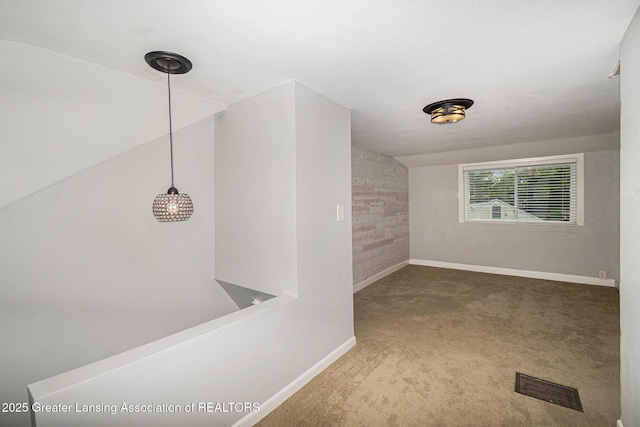interior space featuring baseboards and visible vents