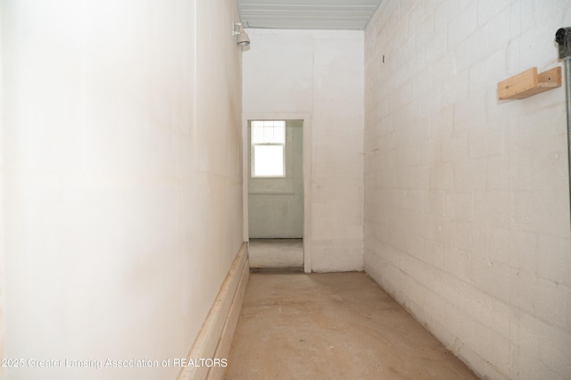 corridor featuring unfinished concrete floors