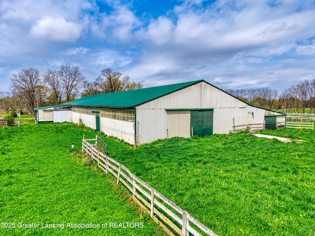 2820 N Lima Center Rd, Dexter, MI 48130 - view of pole building with a yard and fence