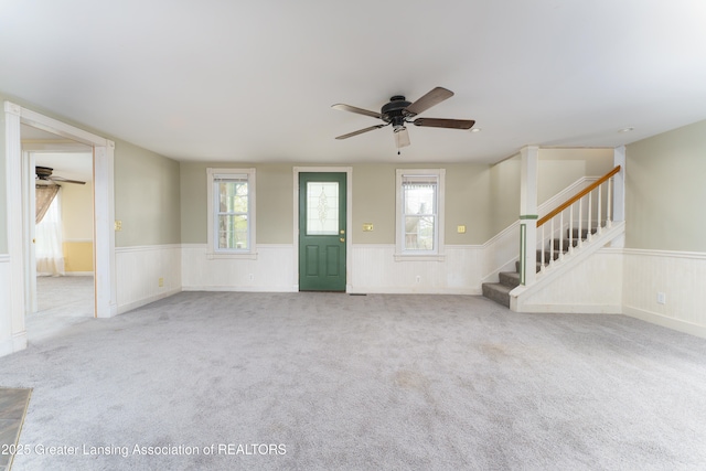 2820 N Lima Center Rd, Dexter, MI 48130 - unfurnished living room with a ceiling fan and wainscoting