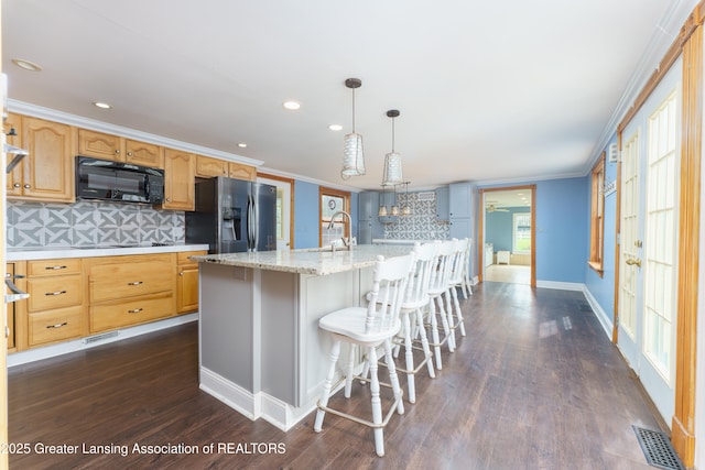 2820 N Lima Center Rd, Dexter, MI 48130 - kitchen with ornamental molding, visible vents, backsplash, black appliances, and dark wood-style floors