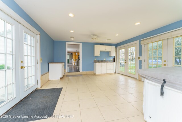 2820 N Lima Center Rd, Dexter, MI 48130 - kitchen featuring light tile patterned floors, french doors, a ceiling fan, and recessed lighting