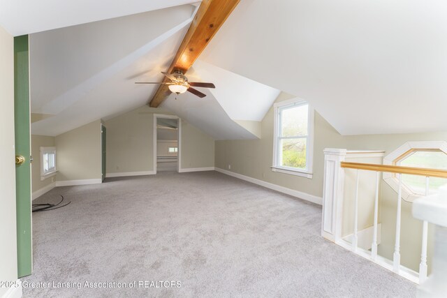 2820 N Lima Center Rd, Dexter, MI 48130 - additional living space with baseboards, vaulted ceiling with beams, a ceiling fan, and carpet floors