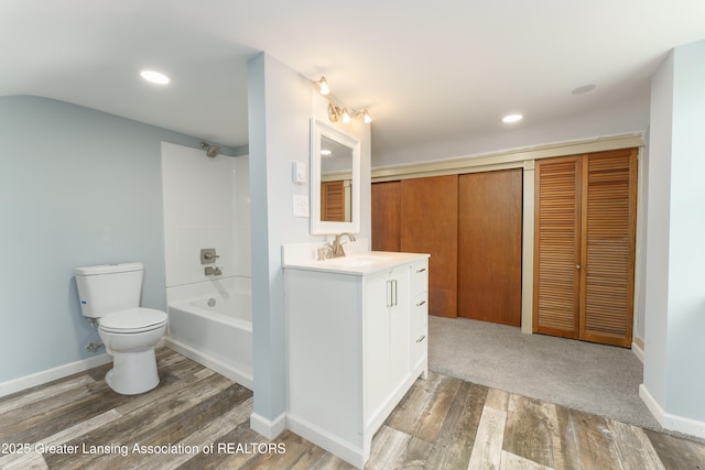 2820 N Lima Center Rd, Dexter, MI 48130 - bathroom featuring vanity, toilet, shower / tub combination, and wood finished floors