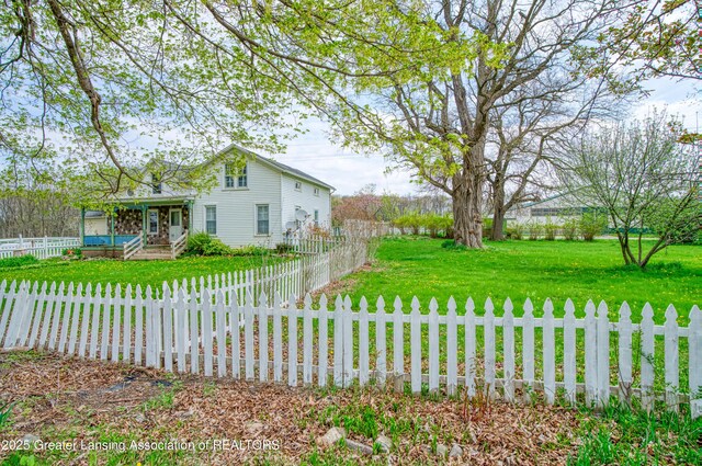 2820 N Lima Center Rd, Dexter, MI 48130 - exterior space featuring a fenced front yard and a front lawn