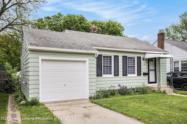 1124 Poxson Ave, Lansing, MI 48910 - view of front of property with an attached garage, roof with shingles, driveway, and a chimney