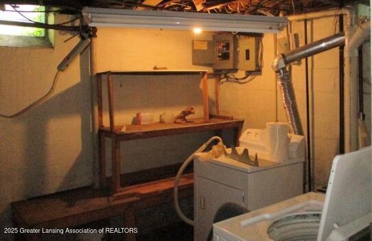 basement with washer / clothes dryer and concrete block wall