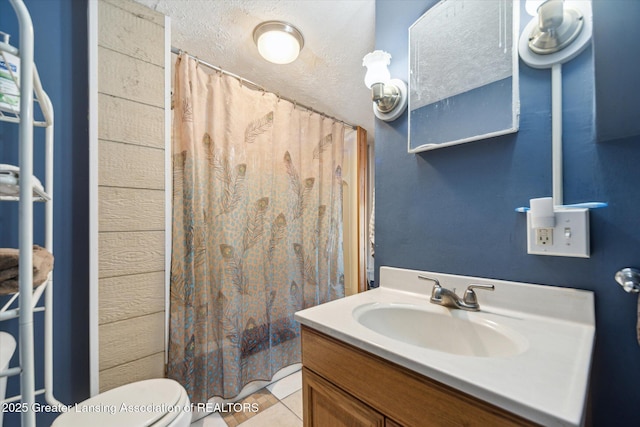 full bathroom featuring toilet, vanity, tile patterned flooring, and shower / bathtub combination with curtain