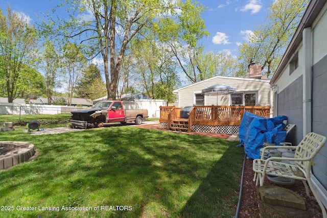 view of yard with a wooden deck