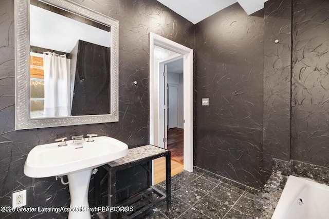 full bathroom featuring a tub