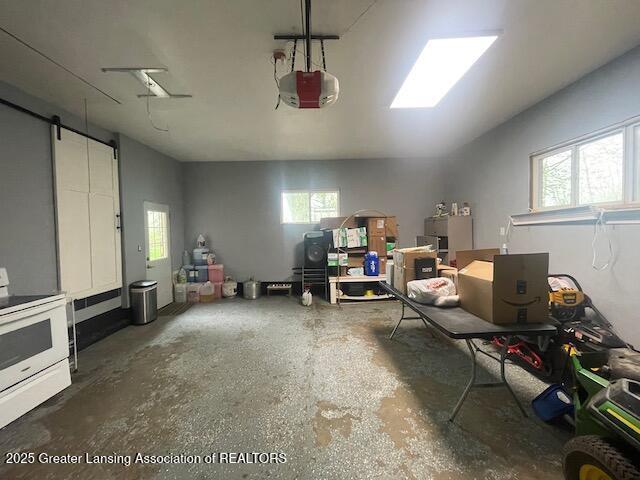 6422 E Saginaw Hwy, Grand Ledge, MI 48837 - garage featuring a garage door opener